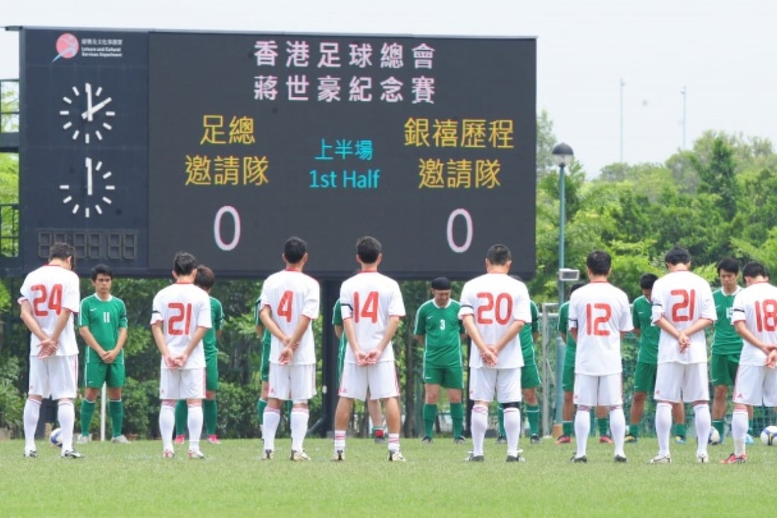 Players observing a minute's silence in 2011 for Valley former skipper Cheung Sai-ho, who committed suicide. During their celebrations, Valley displayed the No 8 jersey worn by Cheung. Photo: SCMP