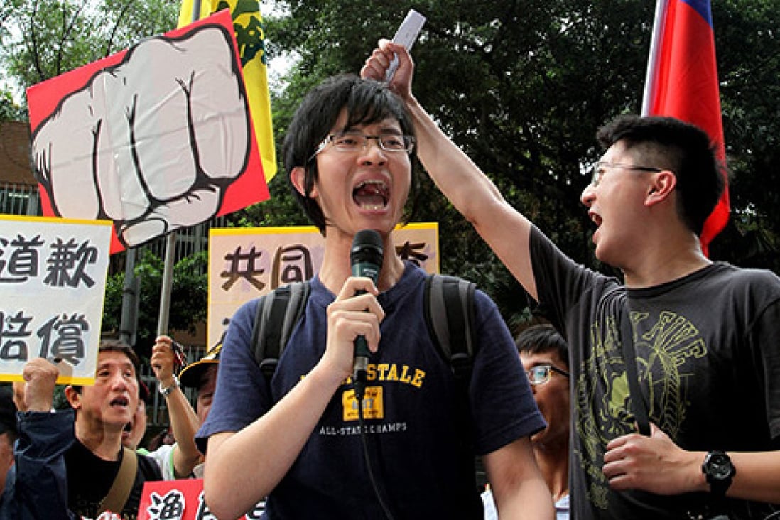 Protesters shout anti-Philippine slogans in front of the Philippine trade office in Tapei on Tuesday. Photo: EPA