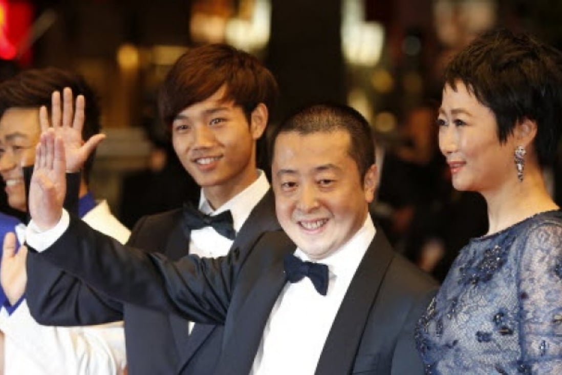  Chinese actor Luo Lanshan, director Jia Zhangke and his wife actress Zhao Tao  in Cannes. Photo: AFP 