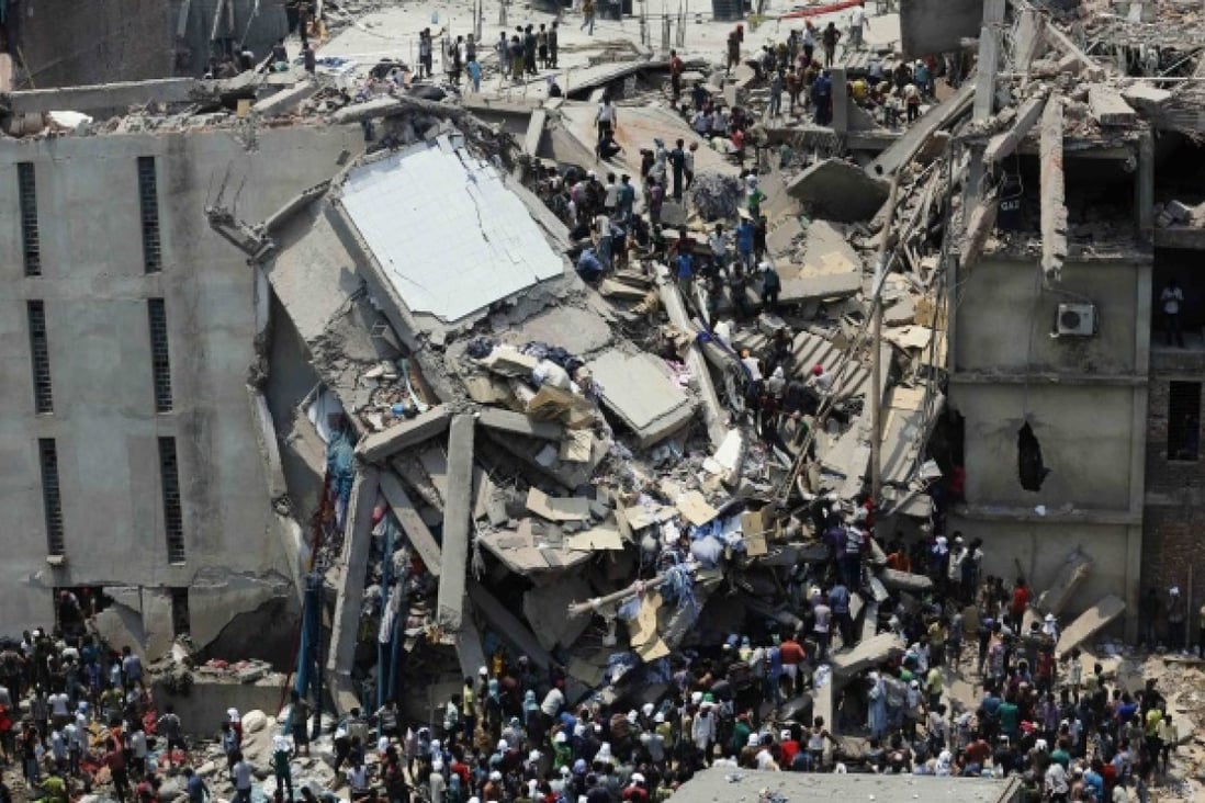 People rescue garment workers trapped under rubble at the Rana Plaza building after it collapsed, in Savar, 30km outside Dhaka. Photo: Reuters