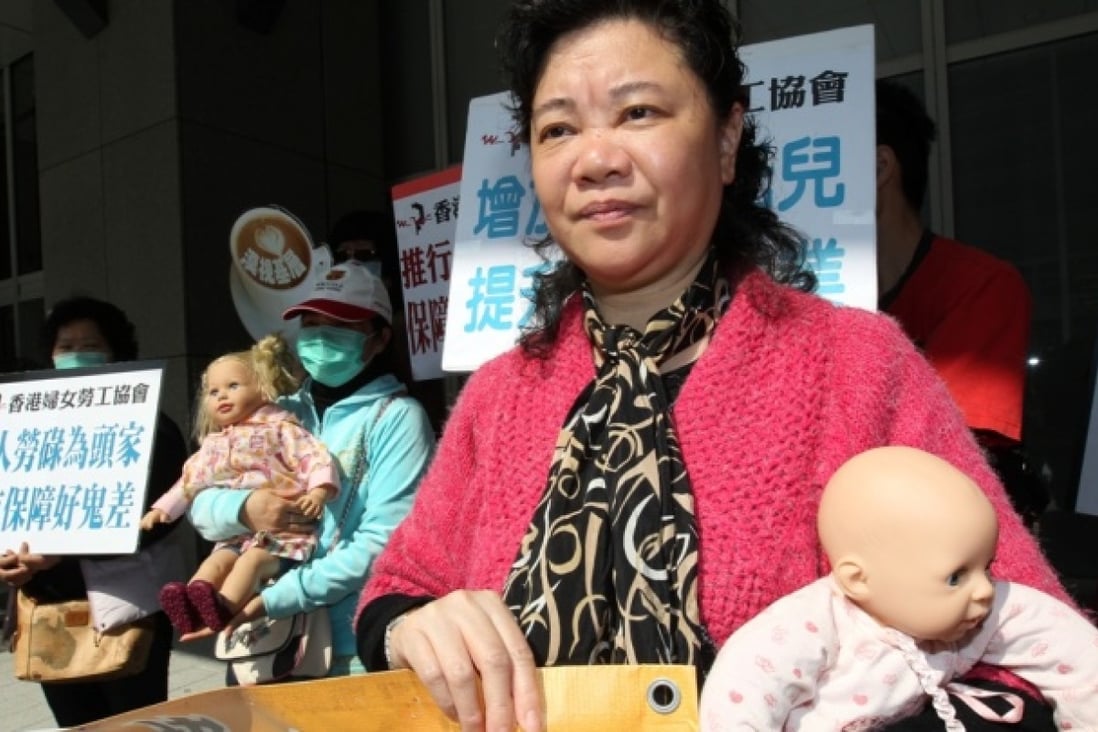 Chiu Man, Member of Hong Kong Women Workers' Association and other members protests against the neglect of women's needs in government policies outside Central Government Offices in Tamar. Photo: Dickson Lee