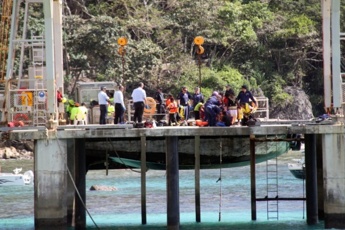 Australian authorities assist asylum seekers who survived their vessel capsizing , 65 nautical miles (around 120 km) of Christmas Island. Photo: EPA