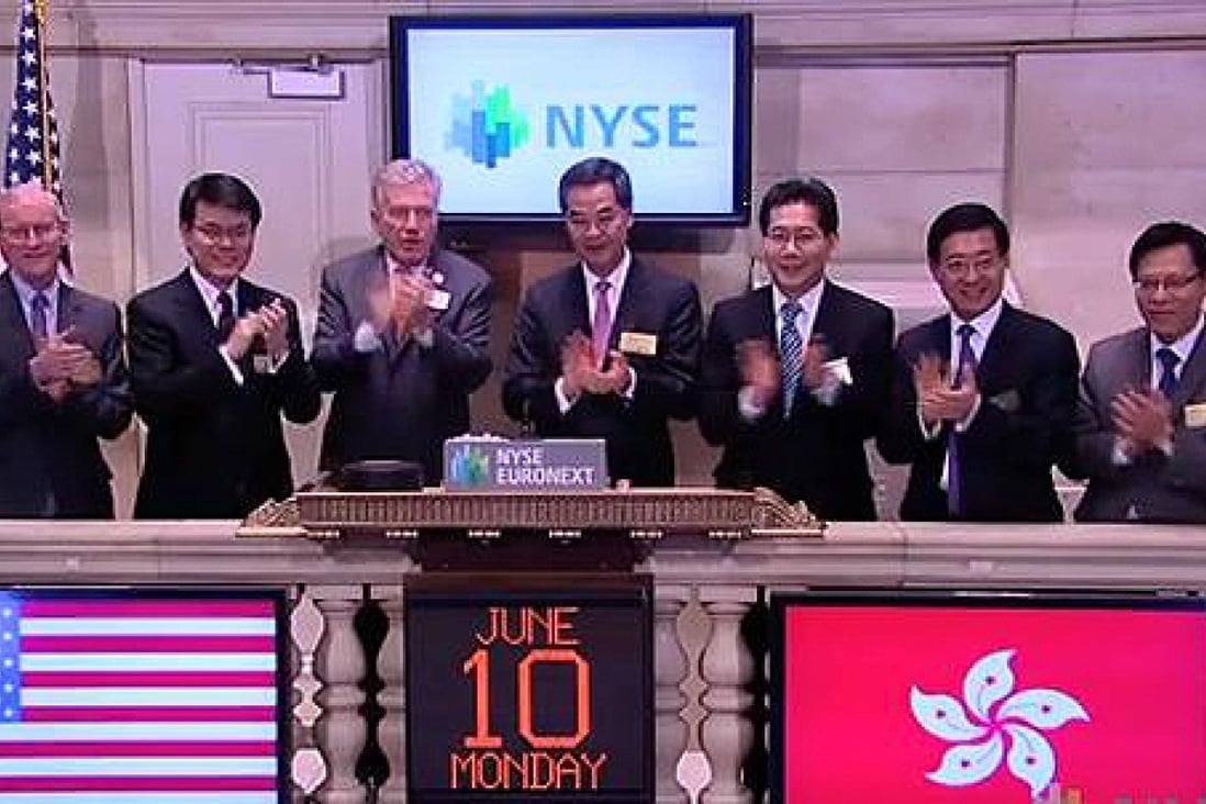 Hong Kong Chief Executive Leung Chun-ying rings the closing bell at the New York Stock Exchange. 