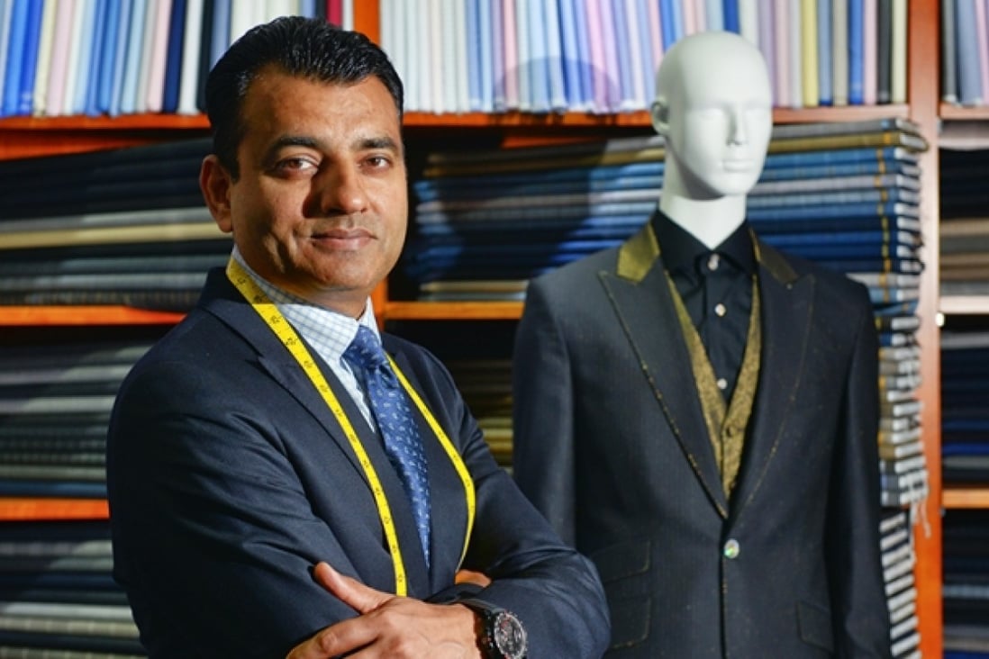 Arshad Mahmood shows off Apsley Tailors' suit. Photo: Thomas Yau
