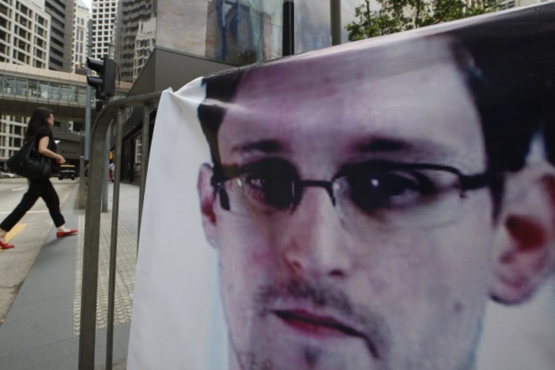 A banner supporting Edward Snowden is displayed at Central, Hong Kong. Photo: AP