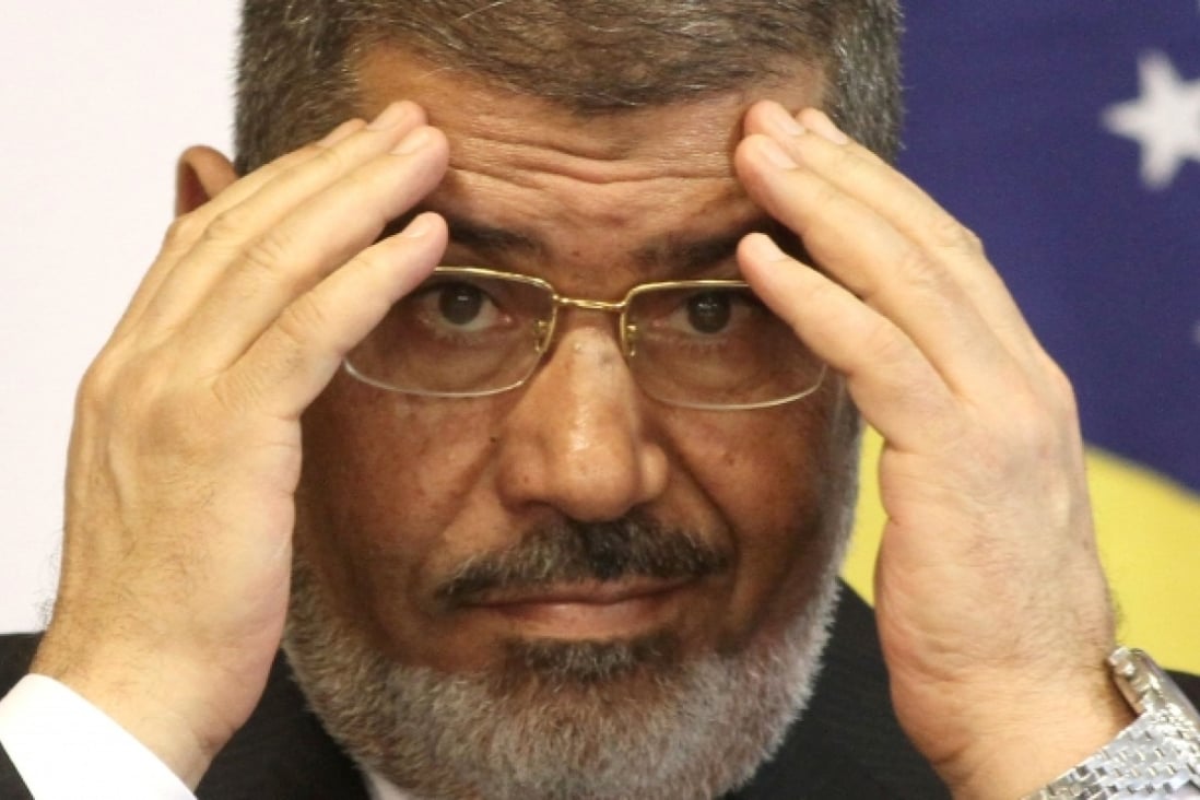 Egyptian President Mohammed Mursi and other Brotherhood leaders have maintained that they were freed by local residents. Photo: AP