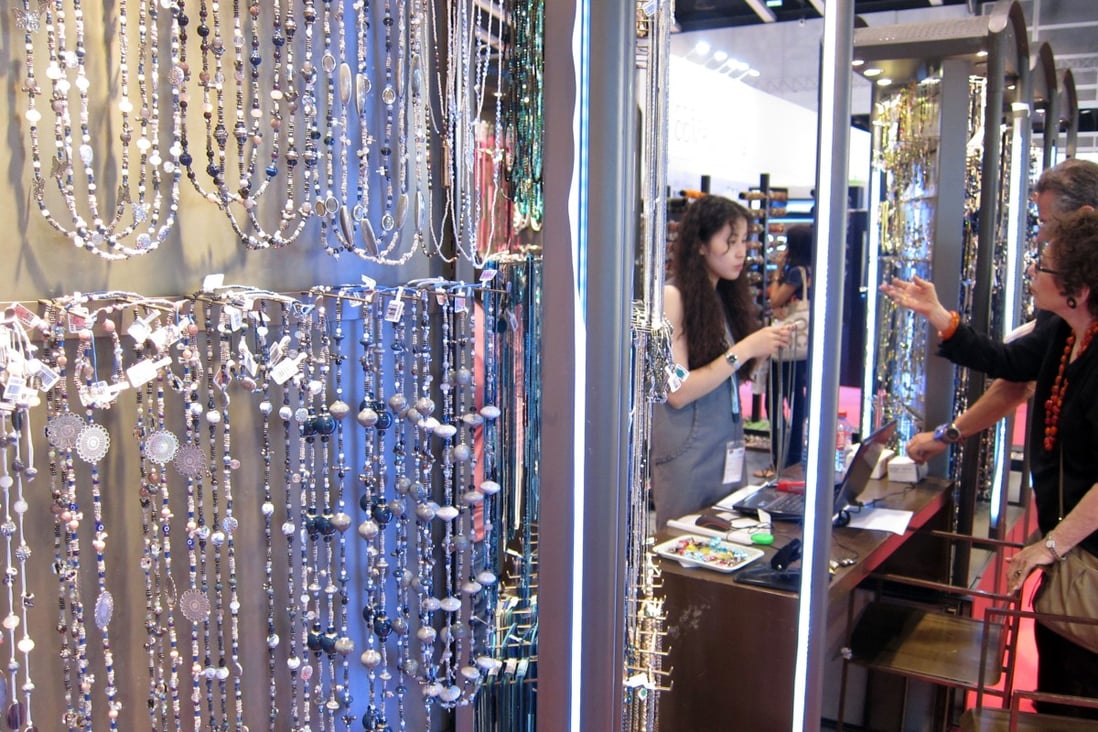 Buyers browse jewellery pieces at the Jewellery & Gem Fair in Hong Kong. Photo: Xinhua