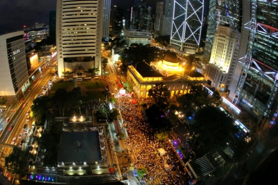Three hundred people attend a forum on the Occupy Central movement at Chater Garden in Central last night following yesterday's march. The movement plans to occupy the central business district next July to press for democracy. Photo: Dickson Lee