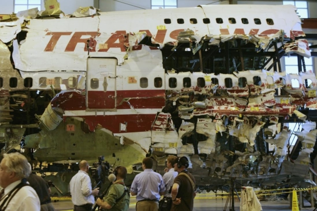The remains of the TWA Flight 800 reassembled from recovered wreckage on display in Ashburn, Virginia. Photo: Reuters