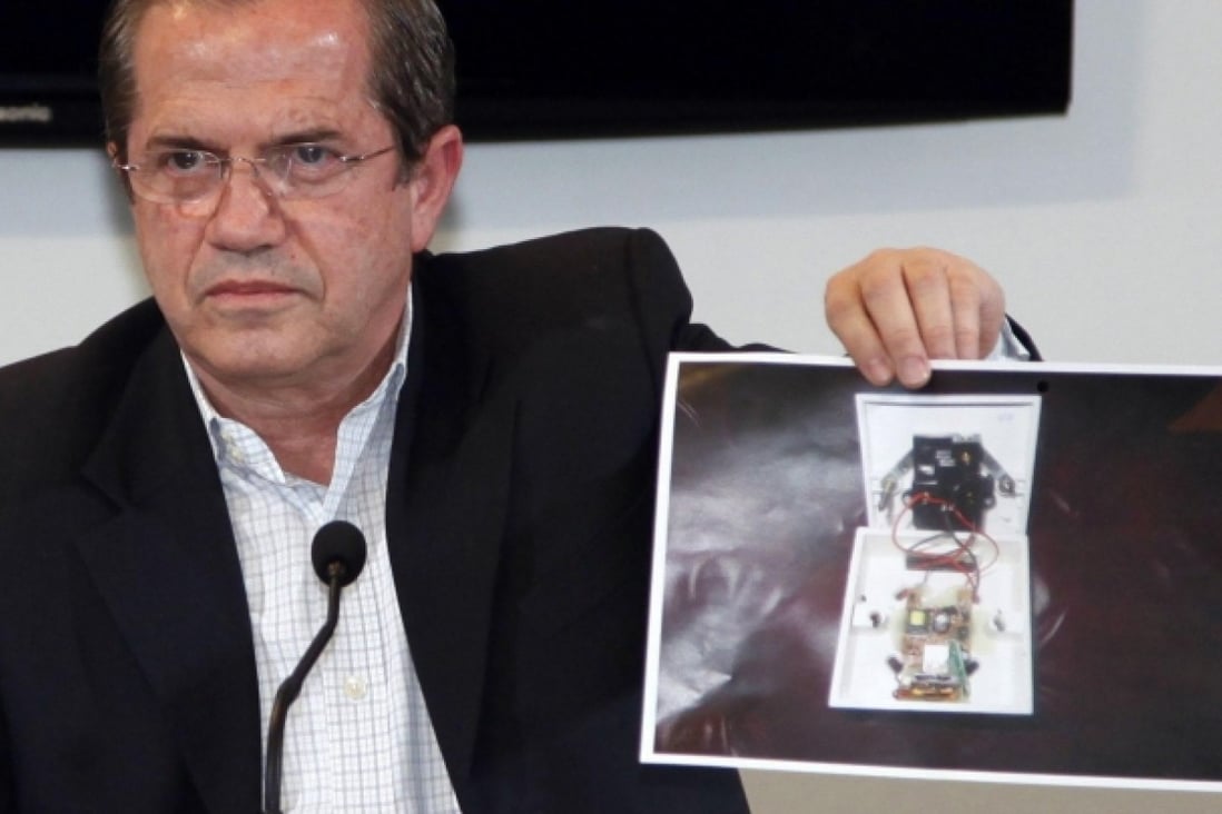 Ecuador's Foreign Minister Ricardo Patino shows a picture of a bugging device found in its London embassy. Photo: Reuters