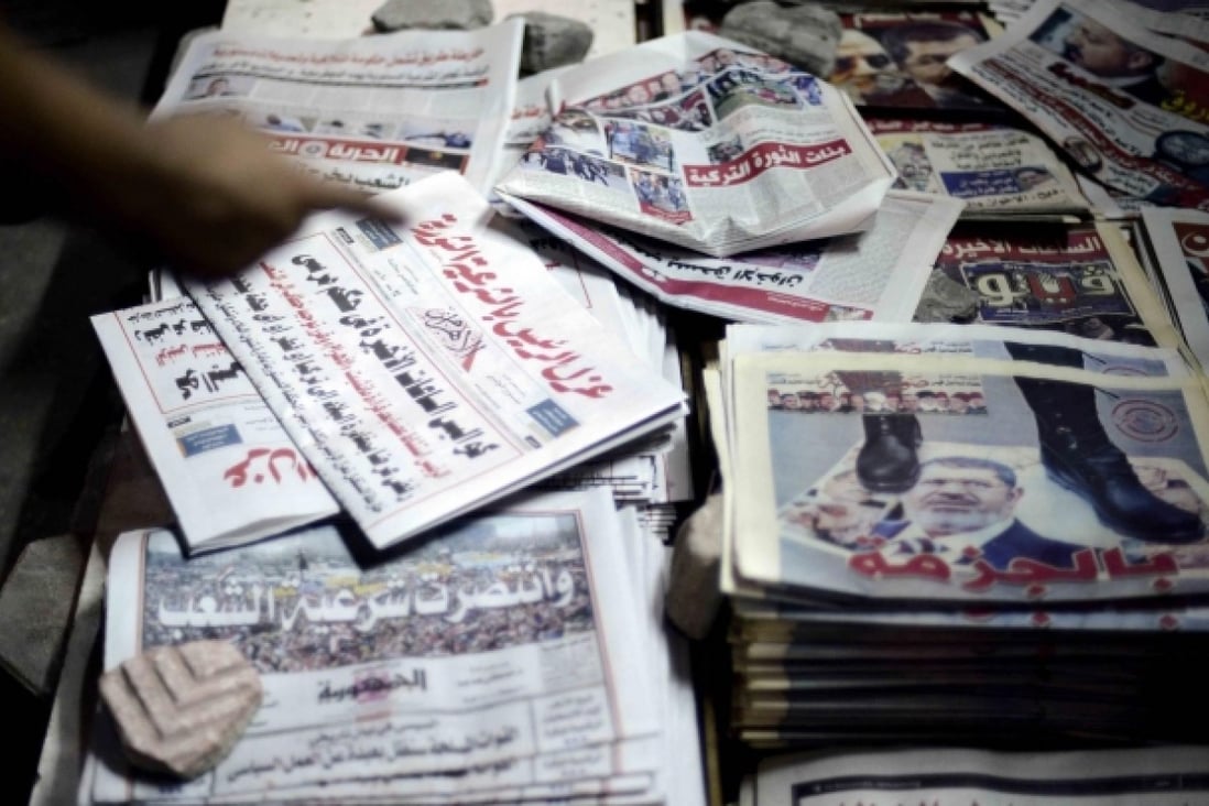 Papers report on the removal of Mohammed Mursi. Photo: AFP