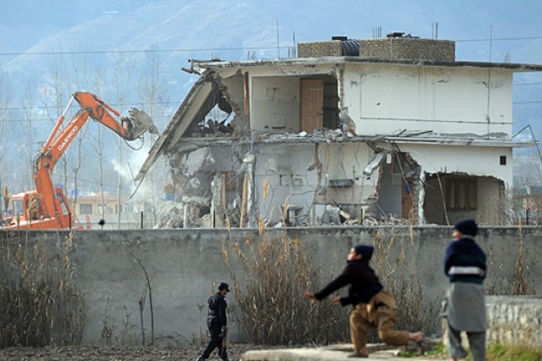 A demolition crew in 2012 works on the compound in Abbottabad where Osama bin Laden was slain. Photo: AFP