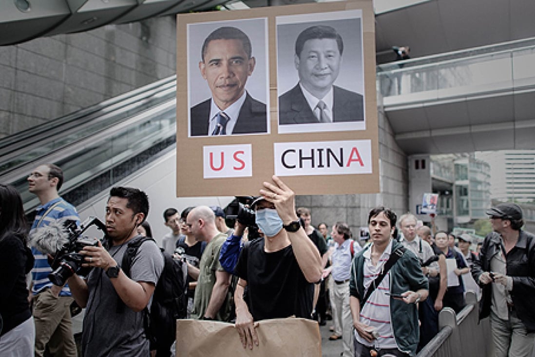 Protesters march to the US consulate in Hong Kong in support of US whistle-blower Edward Snowden on June 15. Photo: AFP