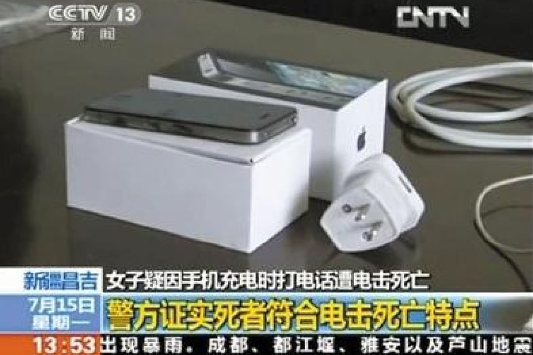 A CCTV screenshot of the phone and the charger, which does not appear to be the standard Apple mainland design. Photo: Screenshot via CCTV