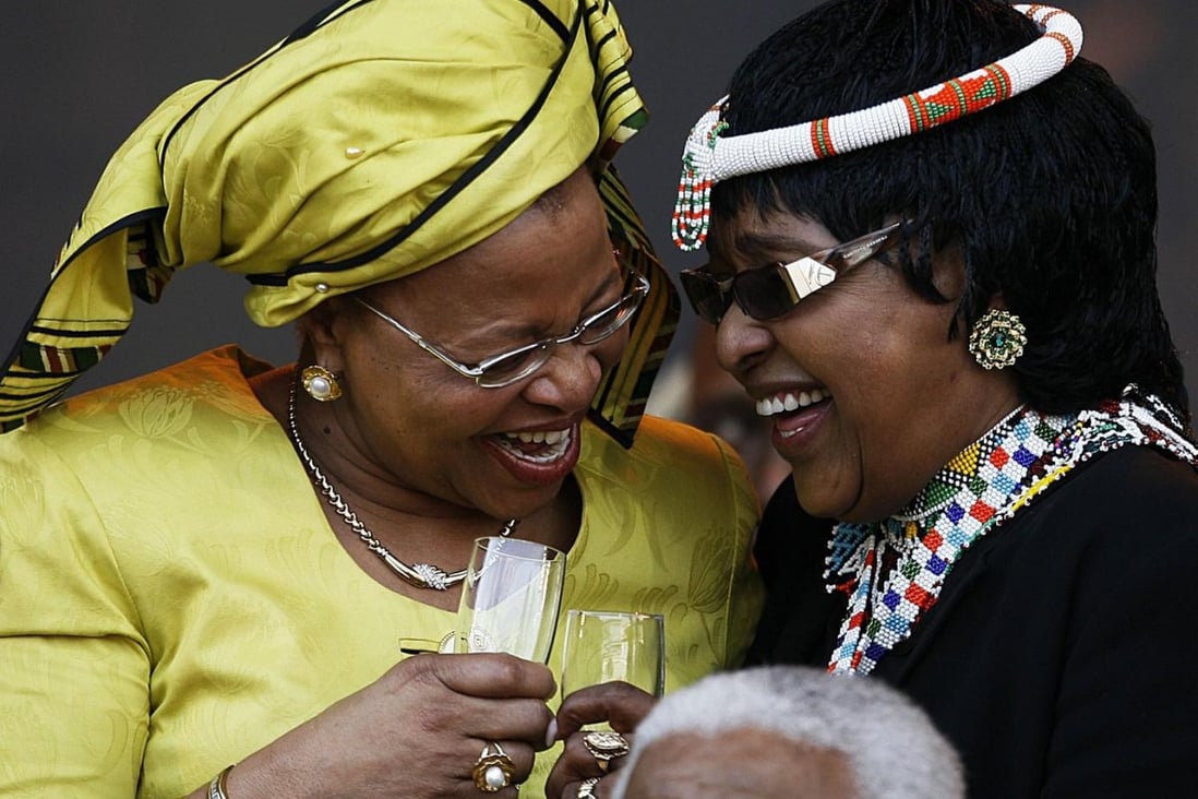 Graca Machel (left), Nelson Mandela and ex-wife Winnie Madikizela-Mandela share a laugh at his 90th birthday party in 2008.Photo: AFP