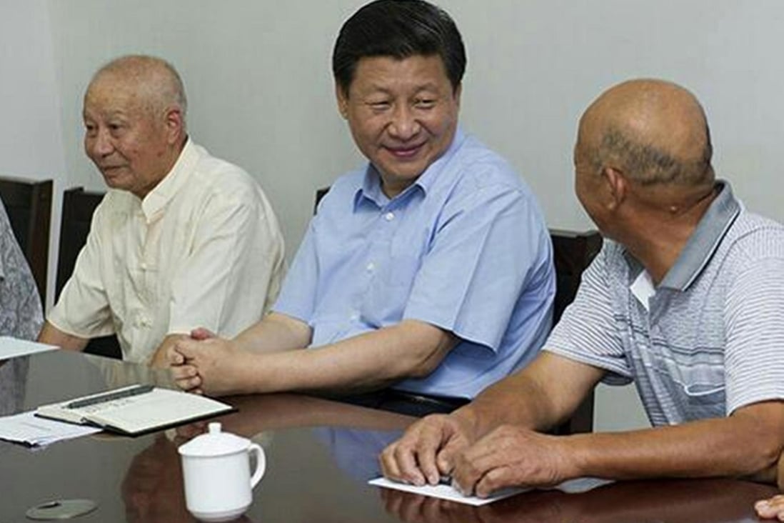 President Xi Jinping talks with a peasant during at a meeting on urbanisation in Wuhan, Hubei, yesterday. Photo: Xinhua