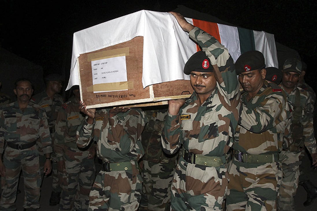 Indian army soldiers carry the coffin of their colleague during a wreath laying ceremony in Poonch, Kashmir. Photo: Reuters