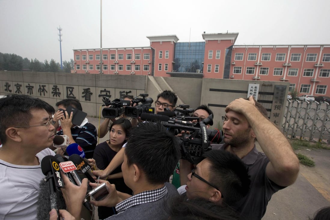 Liu Hui's brother, Liu Tong, addresses the media outside a Beijing detention centre yesterday. Photo: AP