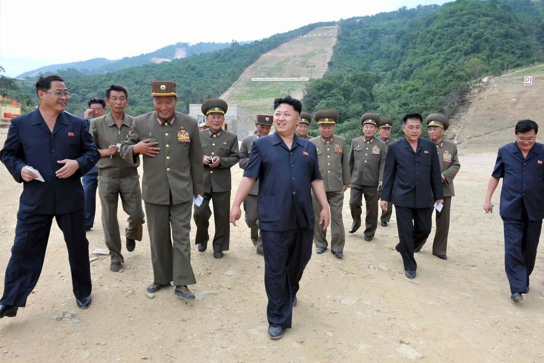 Kim Jong-un and his entourage visit the site of the ski resort at Masik Pass, which he said must be finished by winter.Photo: Reuters
