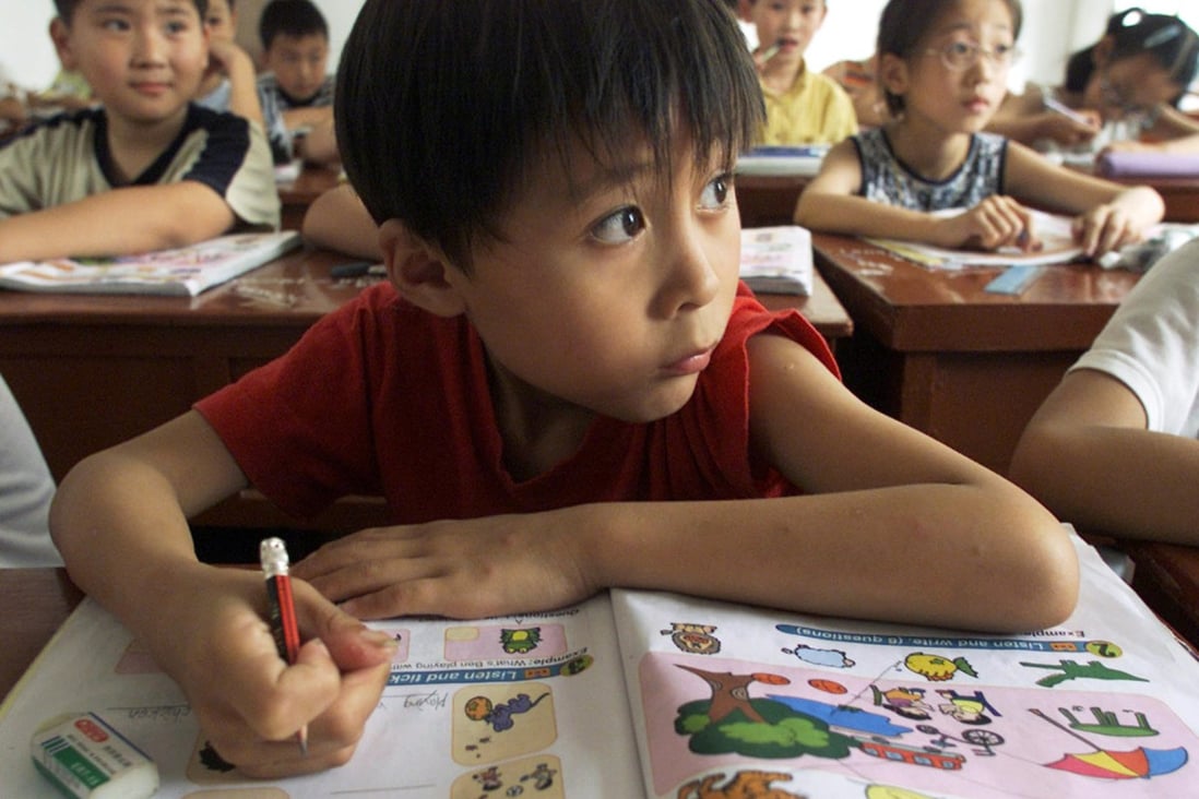 Sun Minyi, 9, listens to his teacher during a special English class in Chongming county, north of Shanghai. Photo: Reuters