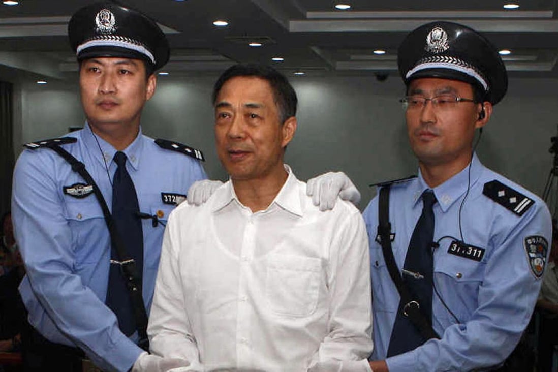Disgraced politician Bo Xilai smiles as he arrives in court for the verdict. Photo: AFP