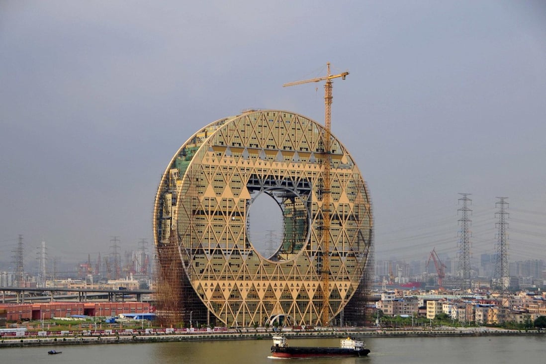 The Guangzhou Yuan Building sits beside the Pearl River. Designers say they were inspired by a jade disc. Photo: Reuters
