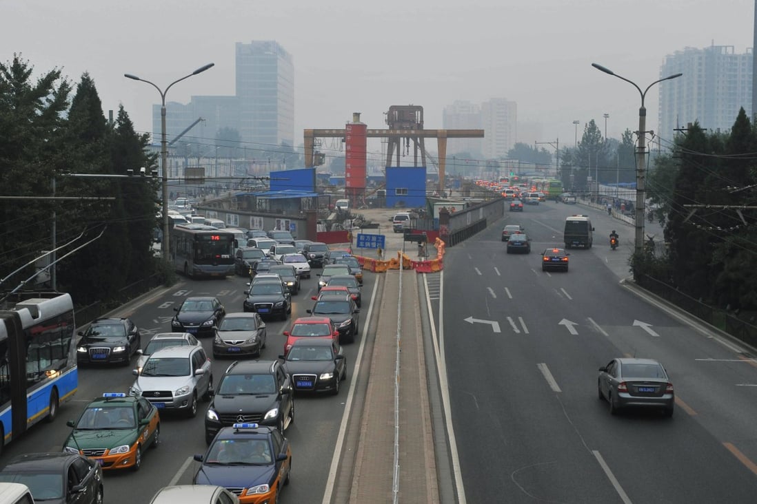 A smog-shrouded road in Beijing. Photo: Xinhua