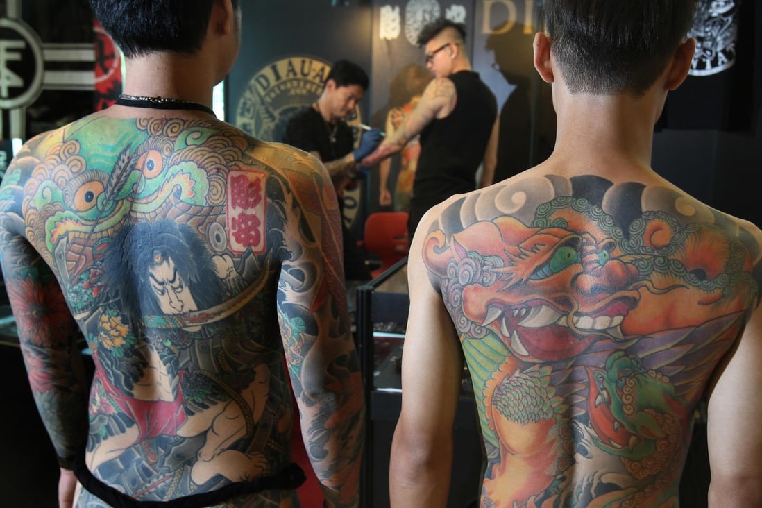 Models show off their full back tattoos by award-winning Taiwanese artist Chen Cheng Hsiung, better known as Diau An. Photo: K.Y. Cheng