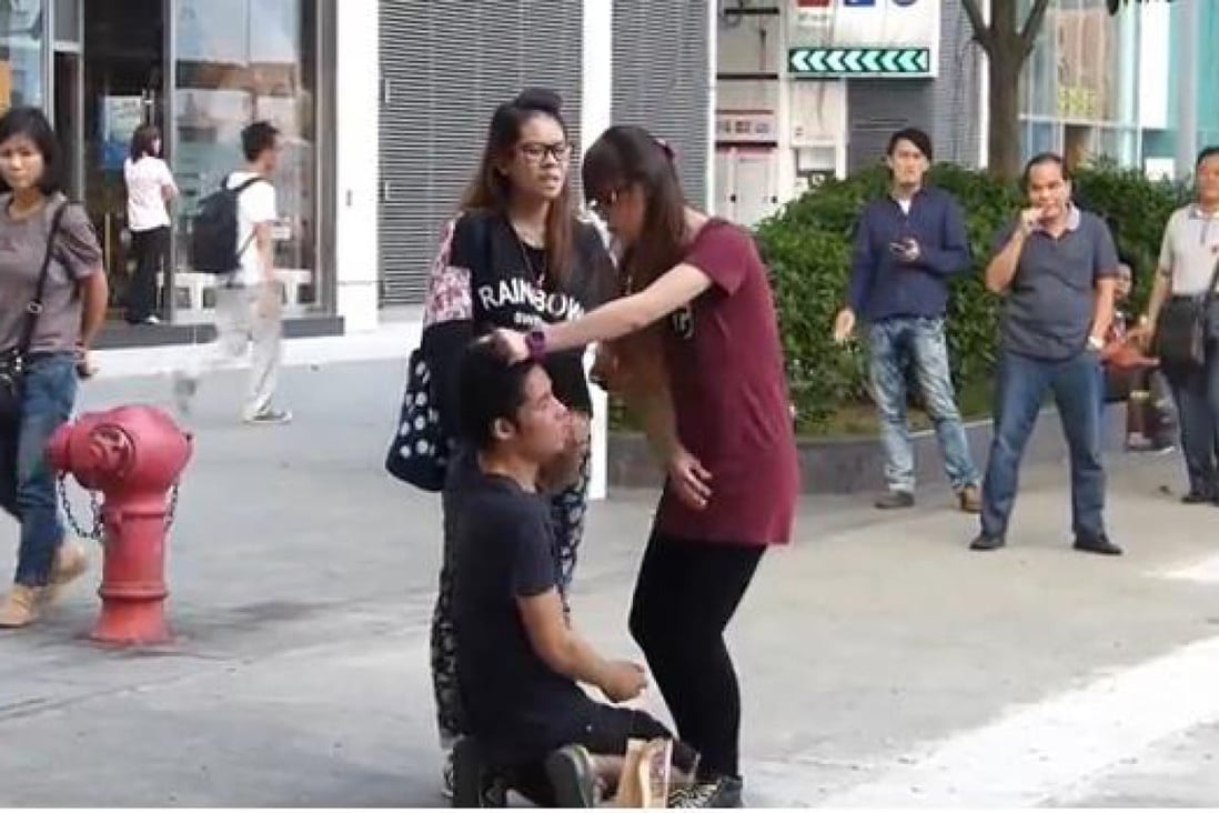 A still from the video shows the girl slapping her boyfriend. 