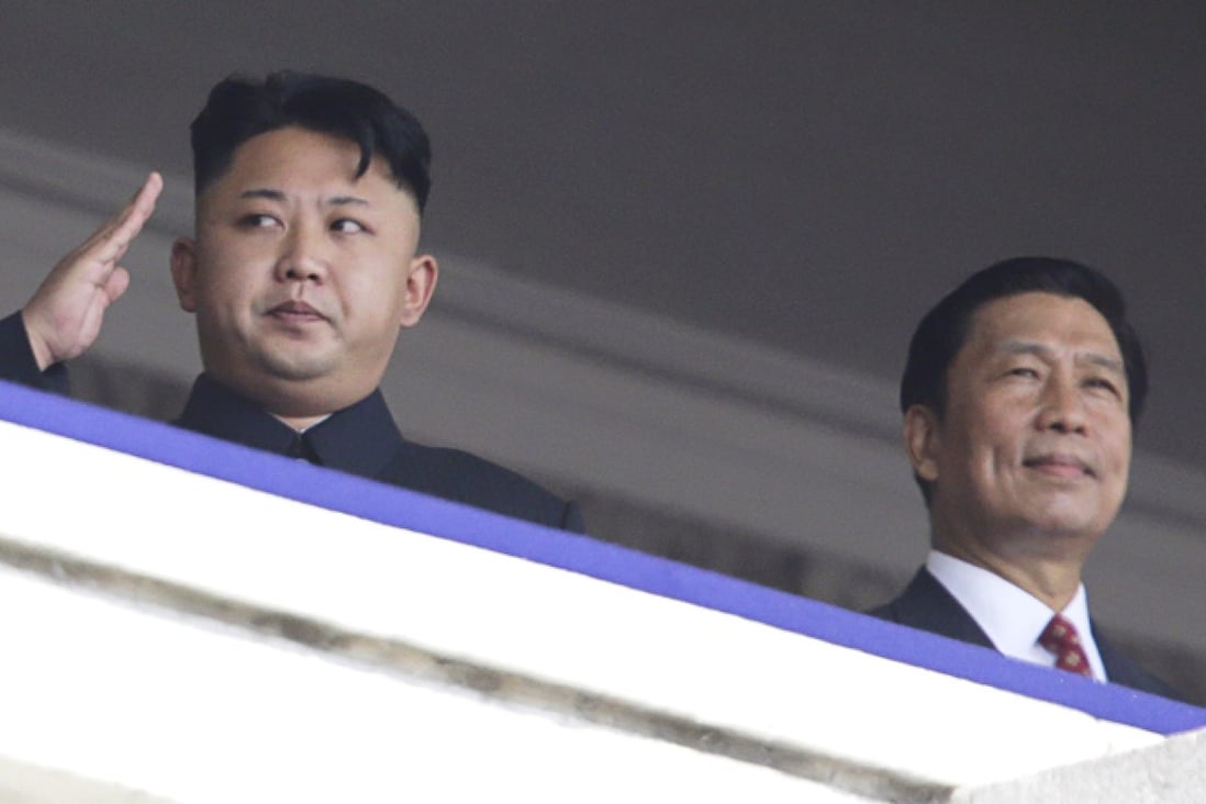 North Korean leader Kim Jong-un salutes next to China's Vice President Li Yuanchao during a parade in Pyongyang. Photo: Reuters