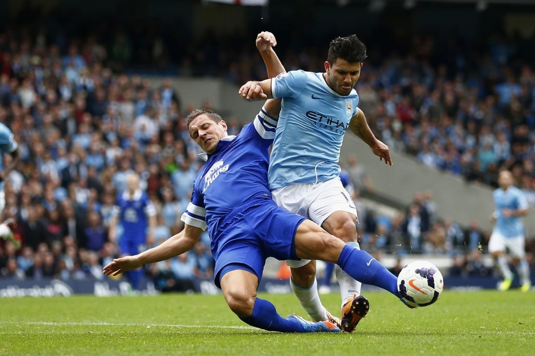 Manchester City's Sergio Aguero being challenged by Everton's Phil Jagielka, who has backed Leighton Baines to stand in for Ashley Cole. Photo: AFP 
