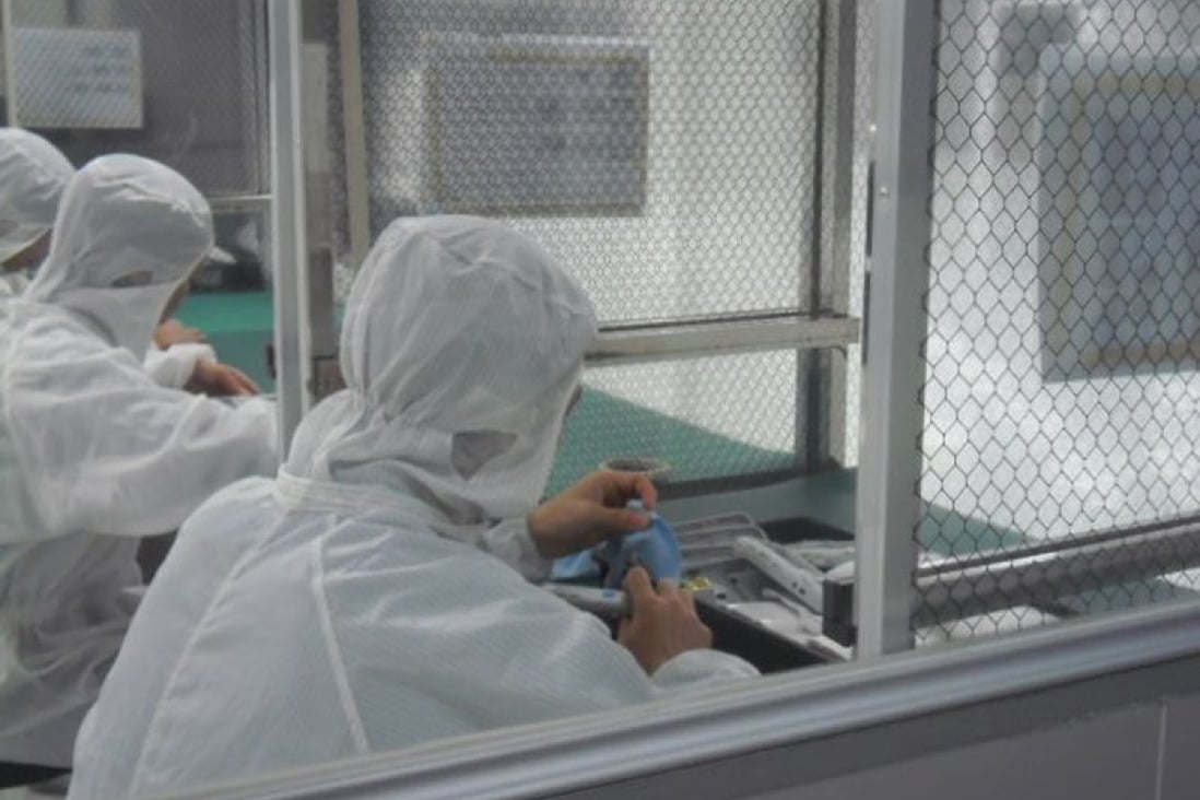Meticulous assembly of a medical device in a clean room at PartnerTech Dongguan