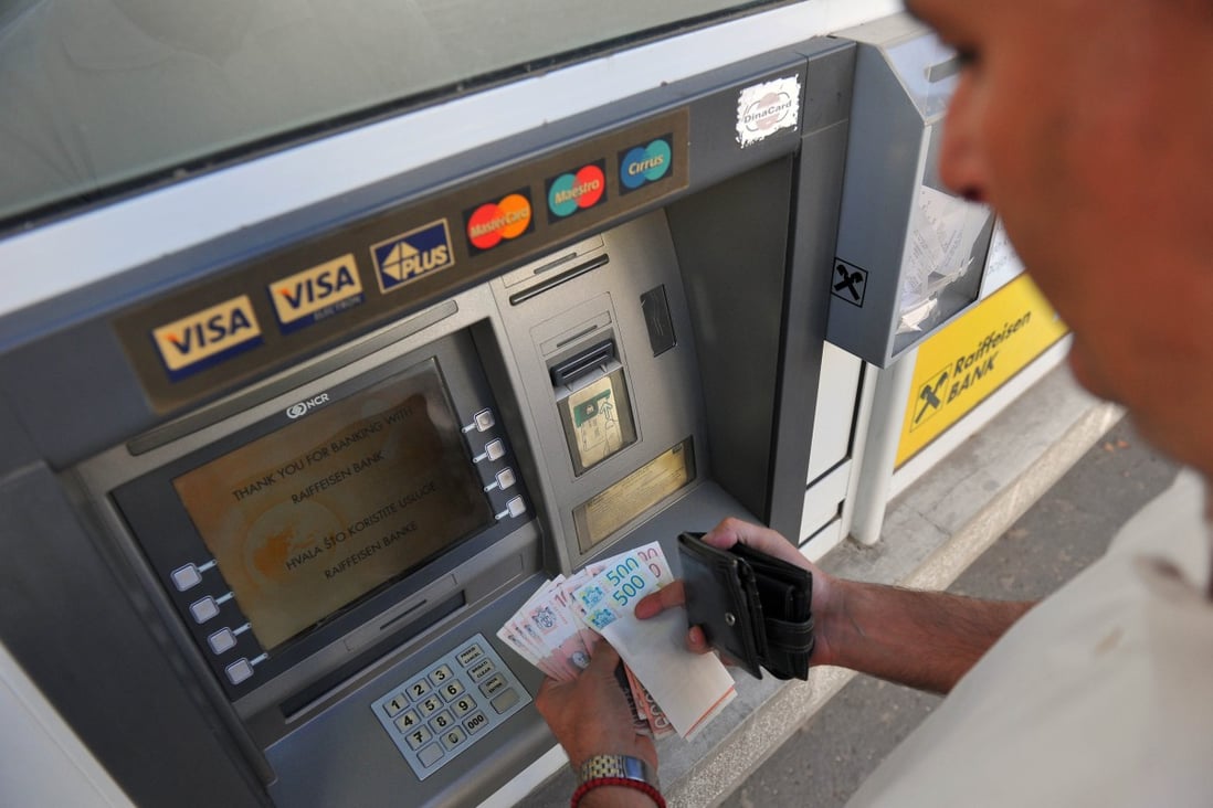 atm maker diebold to pay us 50m in