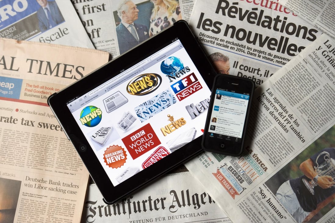 Newspapers' answer to the internet is to make their news available online for reading on digital gadgets such as tablets and smartphones. Photo: AFP