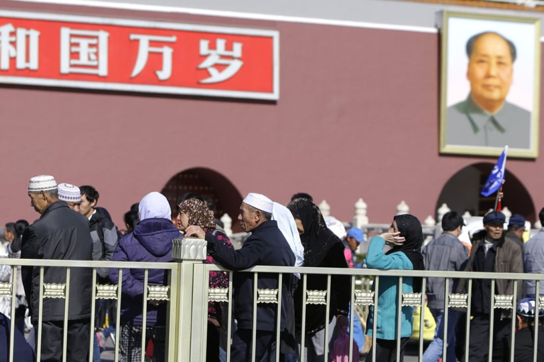 Tourists in front of the gate in Tiananmen Square yesterday,
the scene of Monday’s deadly jeep crash. Photo: Reuters