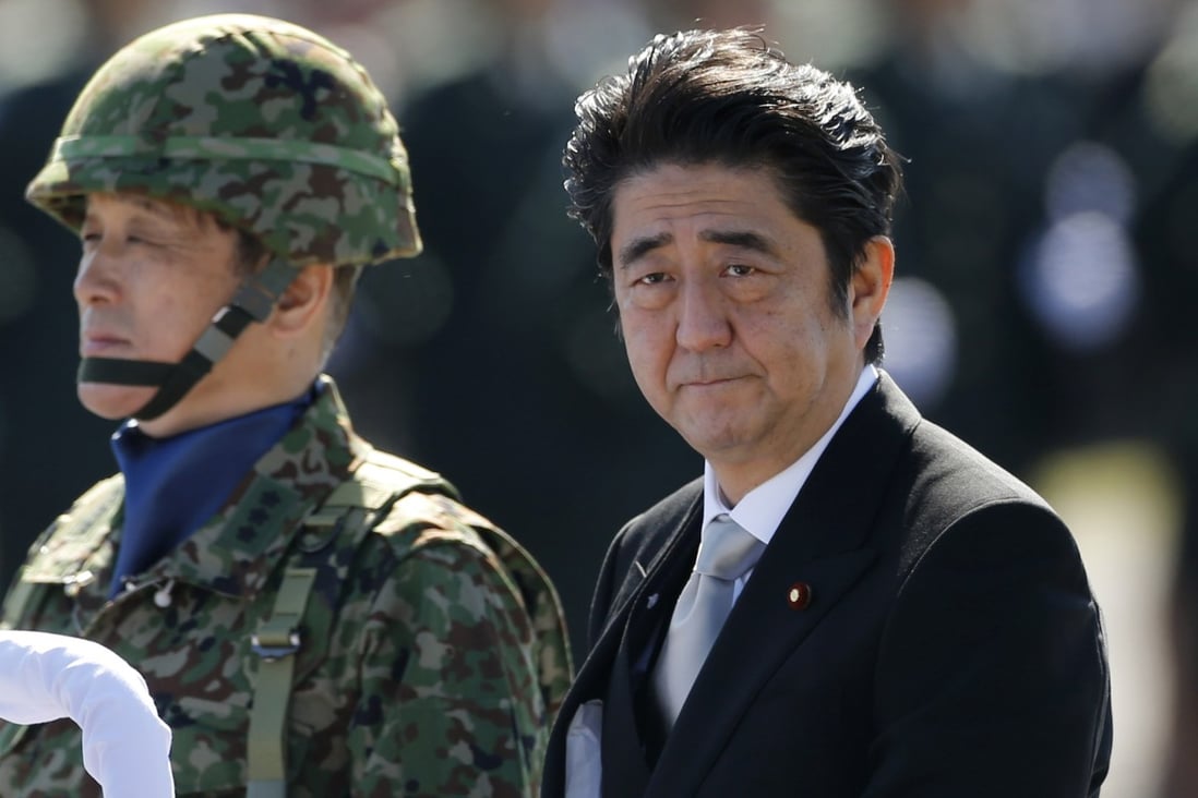 Prime Minister Shinzo Abe reviews Japan's self-defence force troops earlier this year. Photo: Reuters