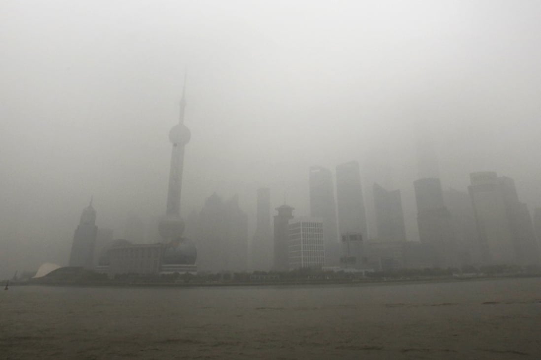 The skyline of the Lujiazui Financial District with the high-rise buildings is covered with heavy smog in Pudong in Shanghai. Photo: AP