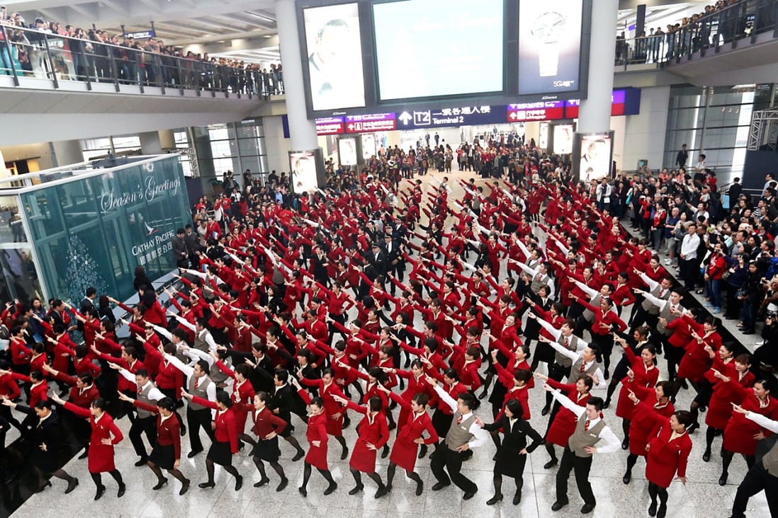 After two weeks of rehearsals, Cathay Pacific crew members give an impromptu dance performance at the arrivals hall of Chek Lap Kok airport. Photo K.Y. Cheng