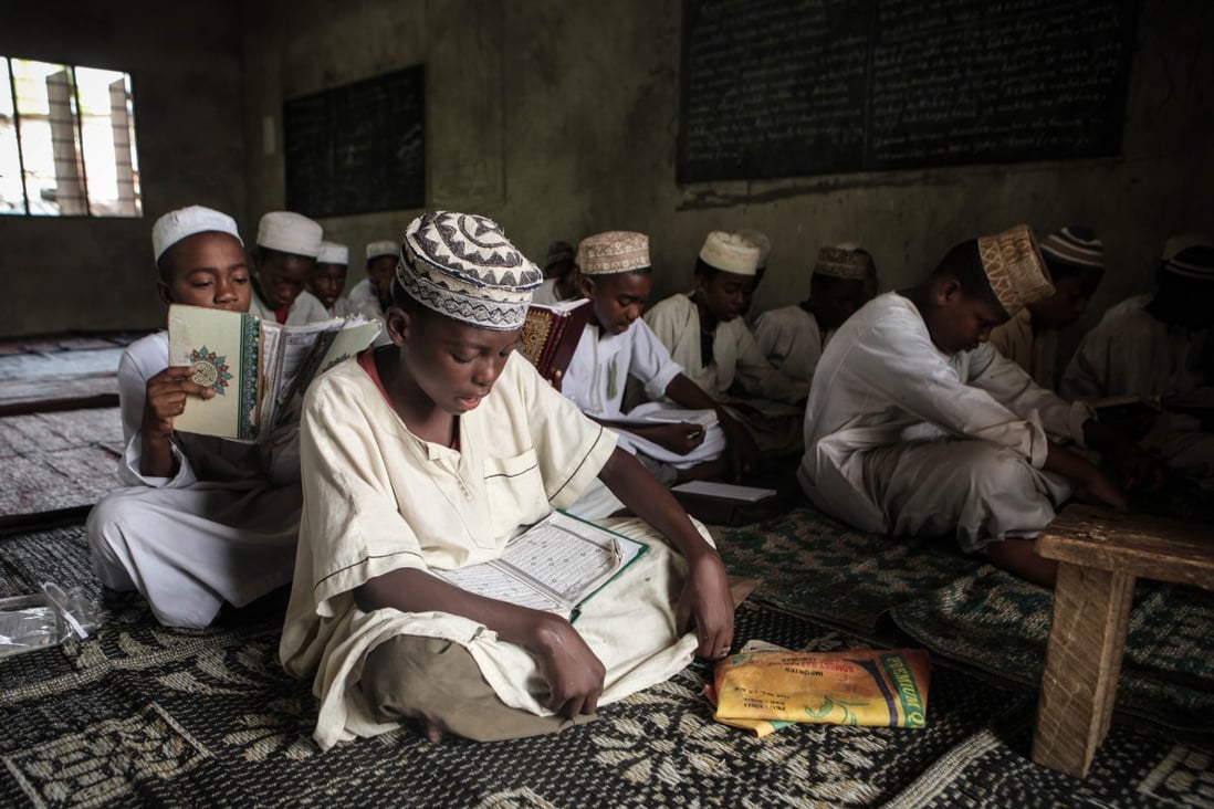 Young muslim students study at a Koranic school in Zanzibar. Photo: AFP