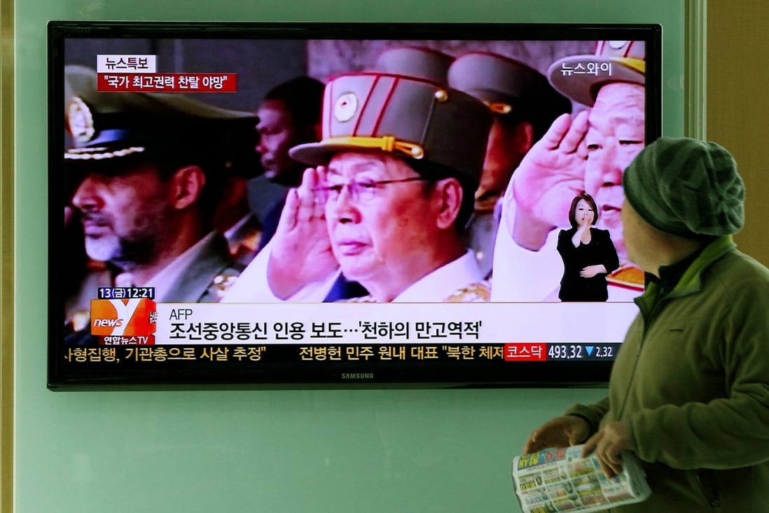 A TV news showing North Korean politician Jang Song-Thaek saluting in Seoul, South Korea. Photo: EPA
