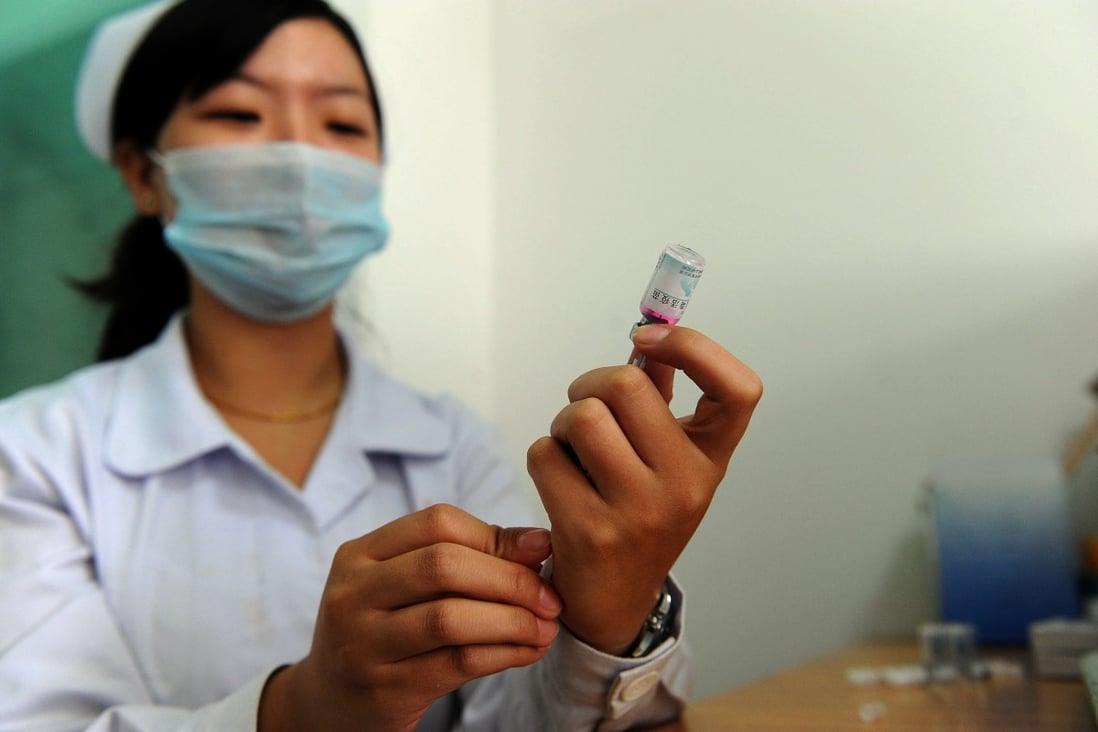 A nurse prepares a vaccine, covered under one of China's immunisation programmes this year. Photo: AFP