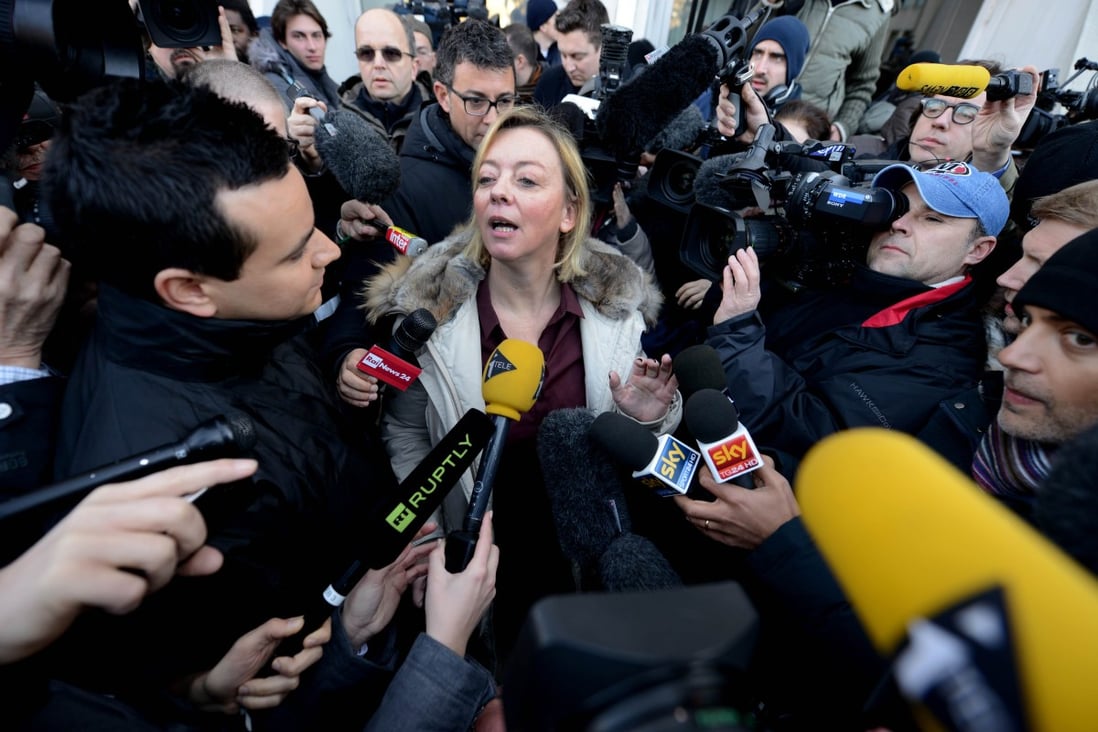 Michael Schumacher's manager, Sabine Khem, speaks to journalists in front of the Grenoble CHU hospital. Photo: AFP