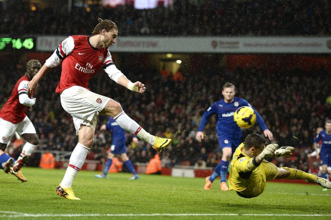 Arsenal's Nicklas Bendtner scores past Cardiff keeper David Marshall during their Premier League match at the Emirates. Photo: Reuters