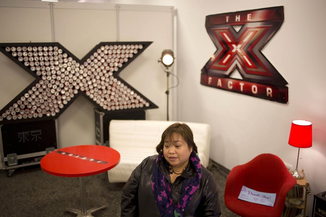 Filipino helper Rose Fostanes prepares to take part in a rehearsal in Tel Aviv forThe X Factor Israel, which has made her a star. Photo: AP