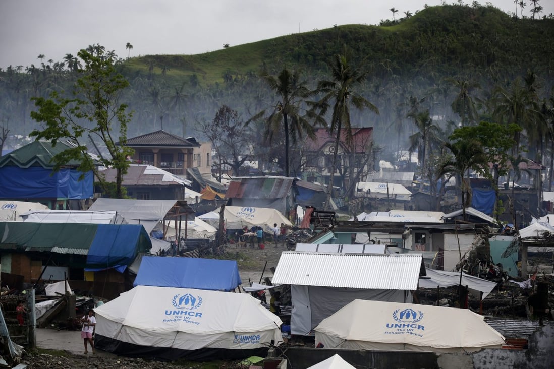 UNHCR tents and makeshift shelters in a typhoon devastated village in Samar. Photo: EPA