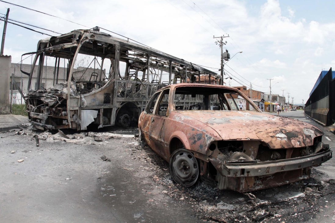 Burned vehicles in Campinas after the killings that started with a policeman's murder. Photo: AFP