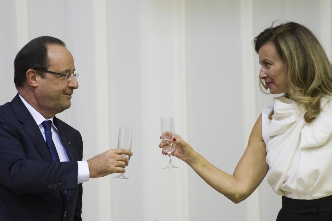 Francois Hollande with partner Valerie Trierweiler - he shed no light on whether she will accompany him as first lady on a visit to the United States next month. Photo: AFP