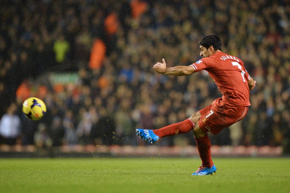 Luis Suarez takes a free-kick. Photo: AFP