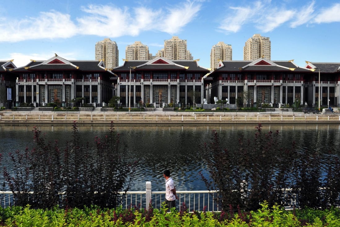 Lakeside villas that were under construction in Beijing's Chaoyang district. The city government approved an expensive real estate project in the district recently, despite a price cap. Photo: AFP
