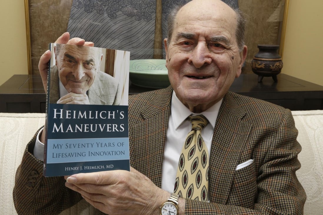 Henry Heimlich with his book. Photo: AP